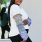 Heimish Full Size Animal Print Ruffle Trim Top -