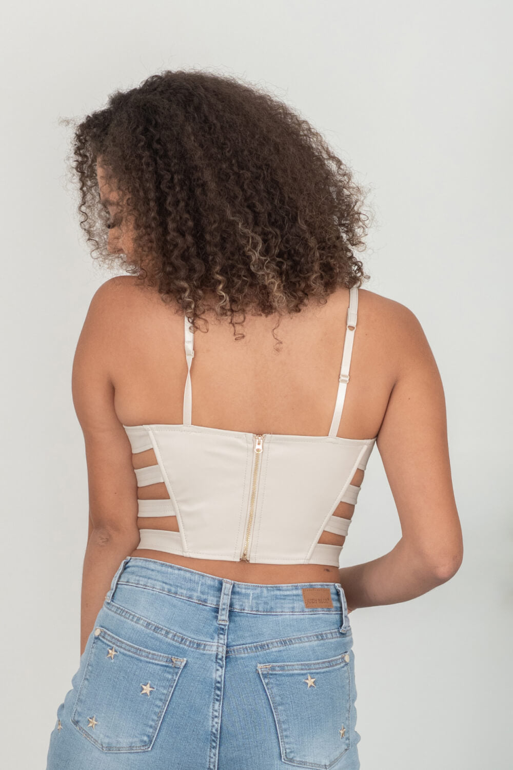 SHOPIRISBASIC Ready to Go Faux Leather Strappy Bustier Crop Top in Oyster -