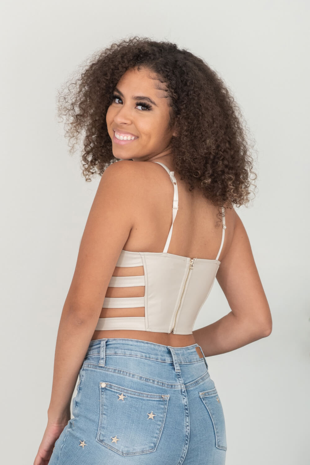 SHOPIRISBASIC Ready to Go Faux Leather Strappy Bustier Crop Top in Oyster -